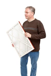 man-with-air-conditioning-air-filter