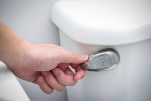 hand-flushing-a-toilet