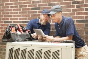 technicians-repairing-an-air-conditioner