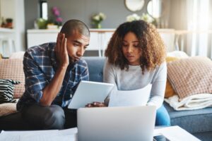 a-young-couple-researching-heating-systems-for-their-home