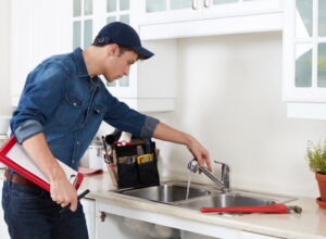 plumber-working-on-a-kitchen-sink